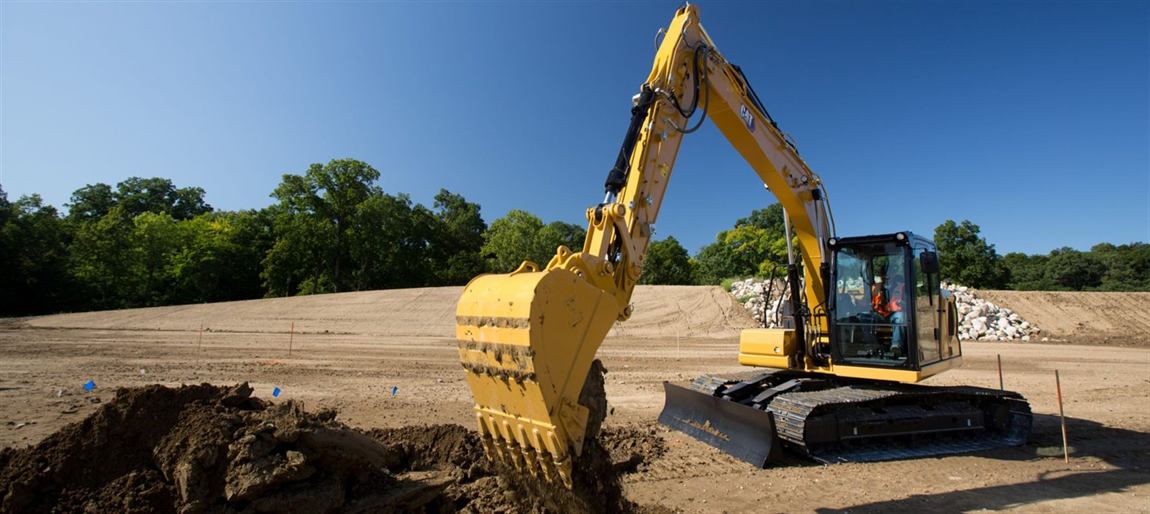 CAT excavator digging on a graded site