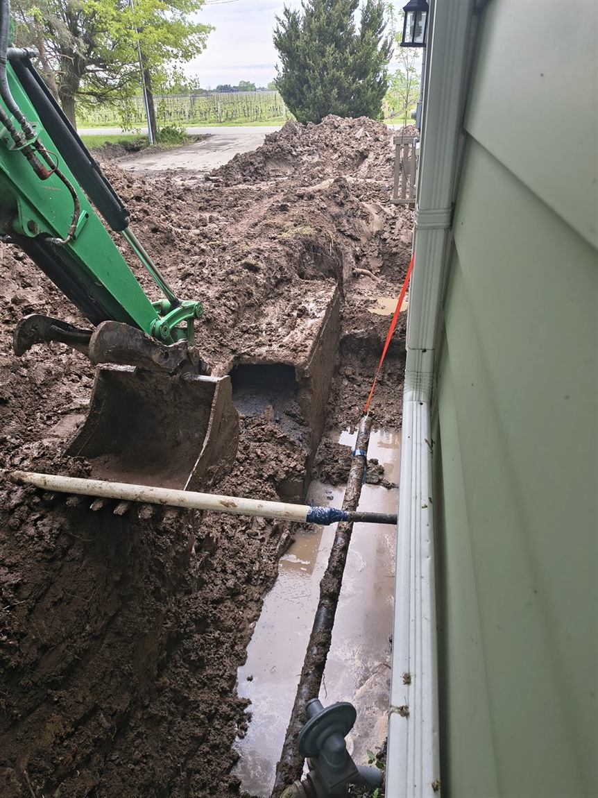 Foundation excavated to footing depth along the wall